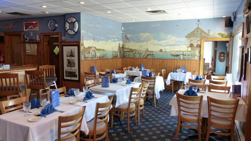 Dining room with mural of dock painted on wall